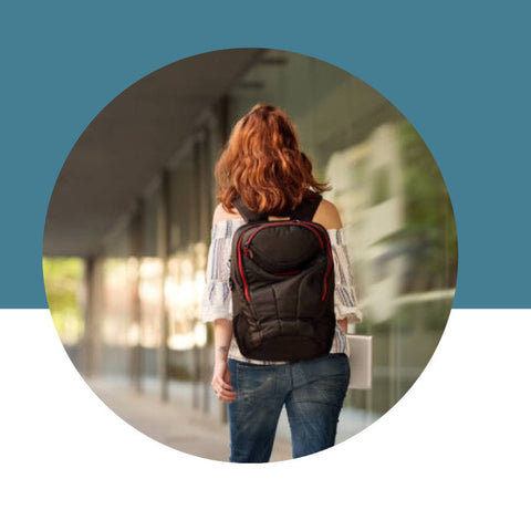 Person with a backpack walking outdoors on a blue and white background