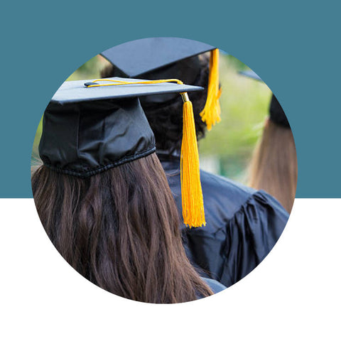 Graduation cap and gown with yellow tassel on a blue and white background