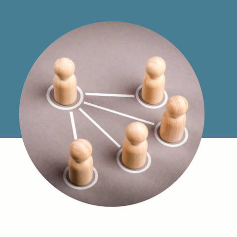 Wooden pegs connected by white strings on a gray circle with a blue background