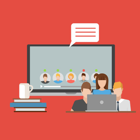 Group of people around a laptop with a screen in the background.