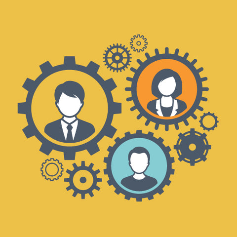 three people inside interconnected gears