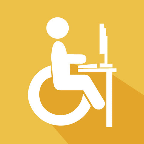 Image of a person in a wheelchair on the computer