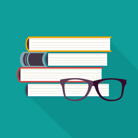 Stack of books and a pair of glasses with teal background.