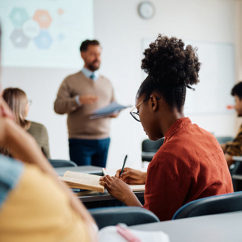 Classroom setting with students and a teacher in a learning environment