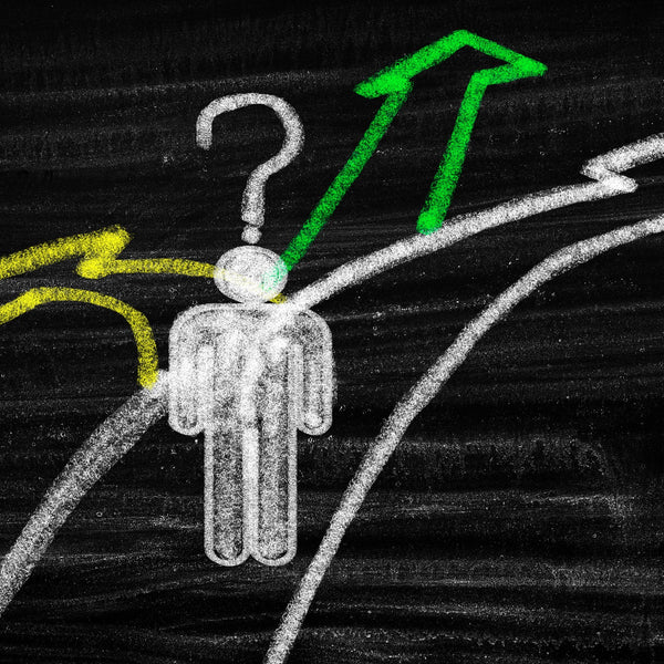 Diagram of a person on a hanger with arrows pointing in different directions on a blackboard.
