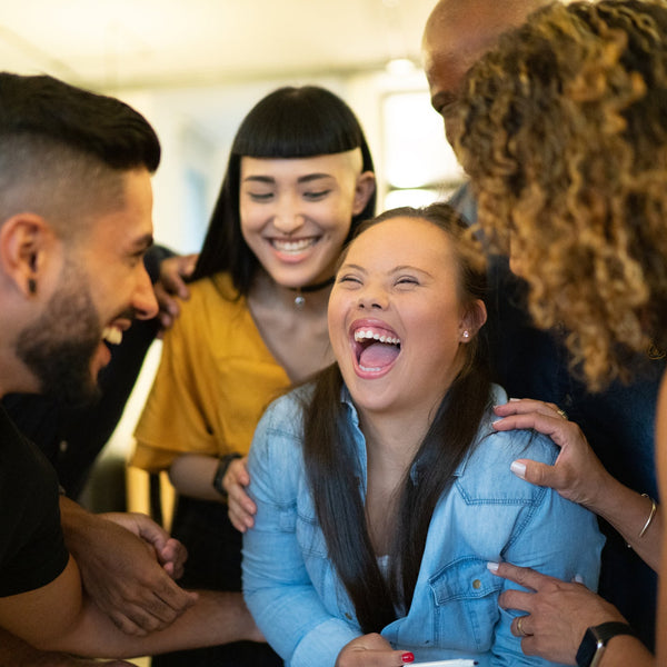 Group of people laughing together in a casual setting