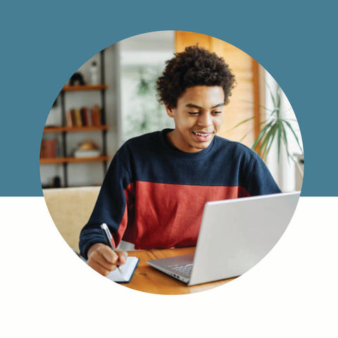 Person using a laptop with a blue background