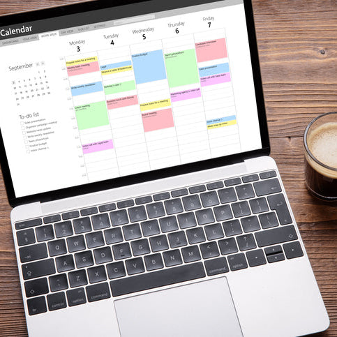 Laptop displaying a color-coded calendar and task list, representing planning, organization, and time management.