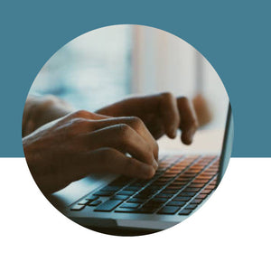 Person typing on a laptop with a blue and white gradient background