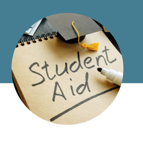 Notebook with 'Student Aid' written on it, topped with a graduation cap, against a blue background.