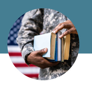 Person in military uniform holding books with an American flag in the background