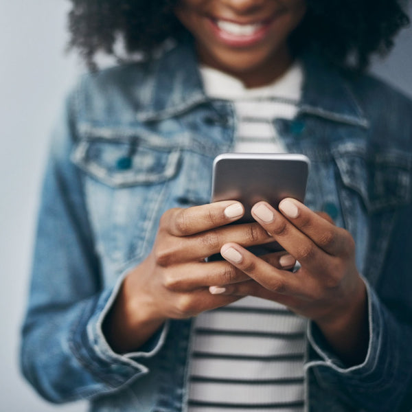 Person using a smartphone with a blurred background