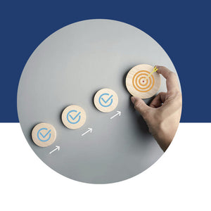 A row of wooden discs with checkmarks leading up to a target
