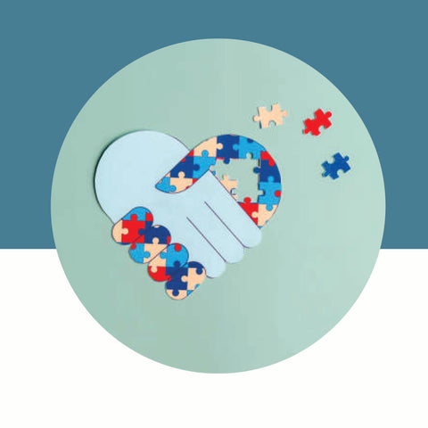Heart-shaped puzzle piece with colorful pieces on a teal background