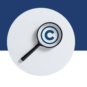 A magnifying glass held over a copyright symbol.