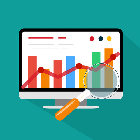 A Computer monitor showing a bar graph. A magnifying glass highlights two of the bars in the graph. 